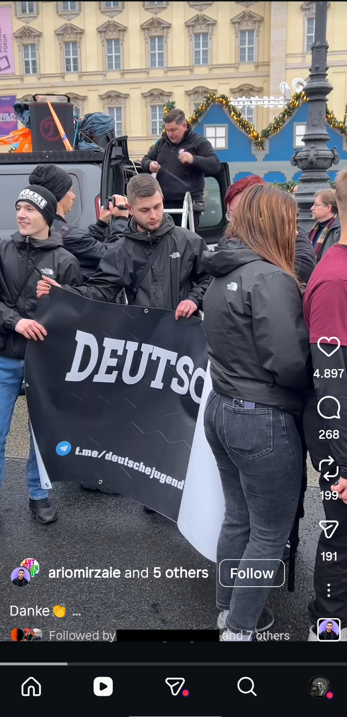 Banner promoting a right-wing Telegram channel at a Berlin rally